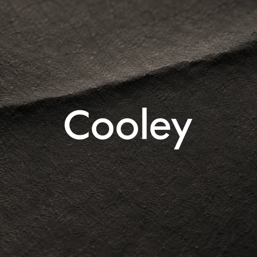Cooley logo over a dark pressed paper texture.
