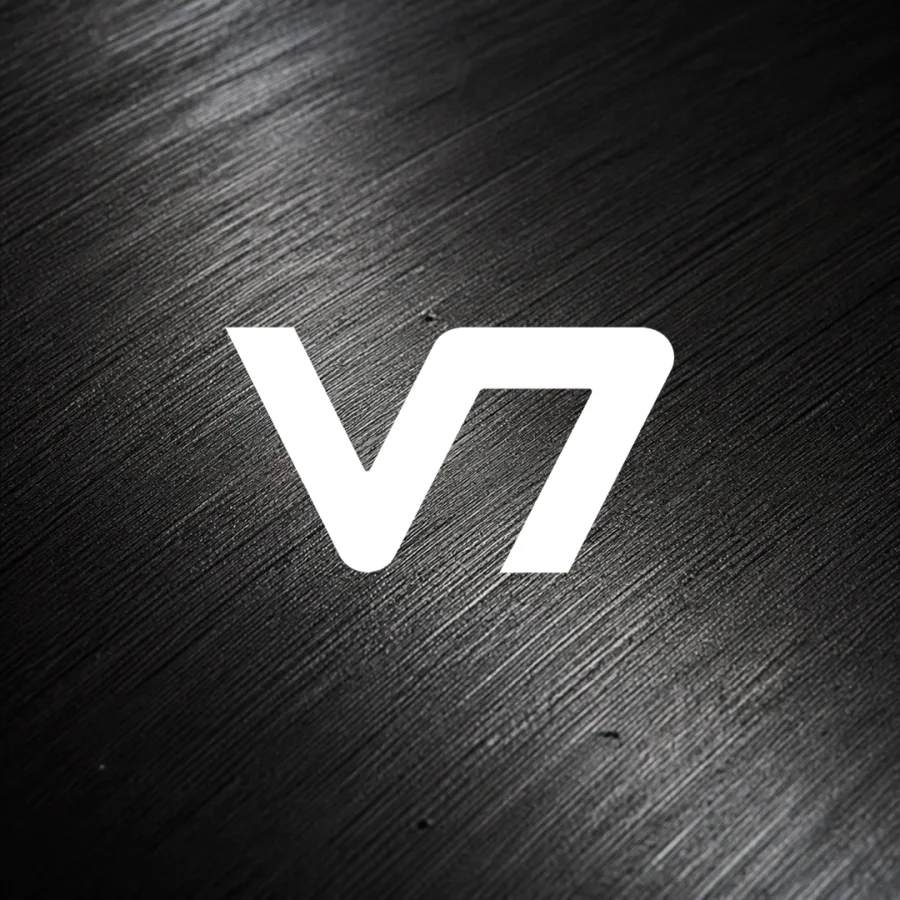 White V7 logo over a black graphite macro texture.