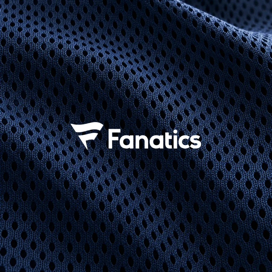 White Fanatics logo centered on dark navy jersey mesh with consistent perforations.